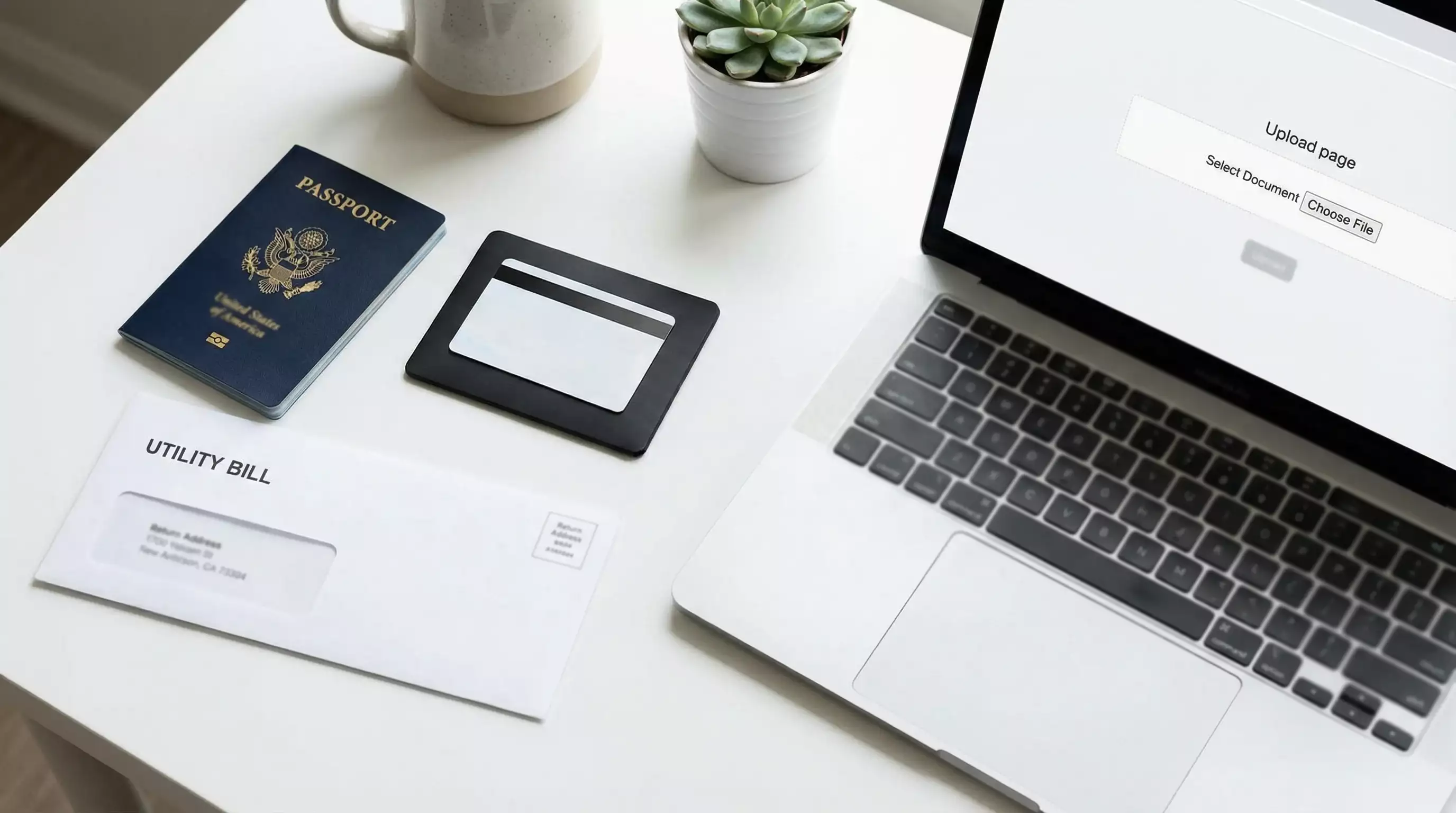 Identity documents and a laptop arranged on a desk for sweepstakes casino KYC verification